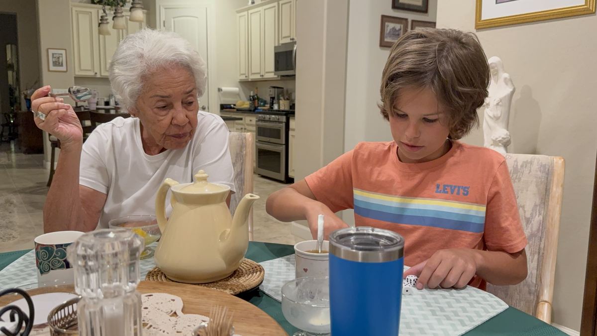 Grandma and grandson having tea