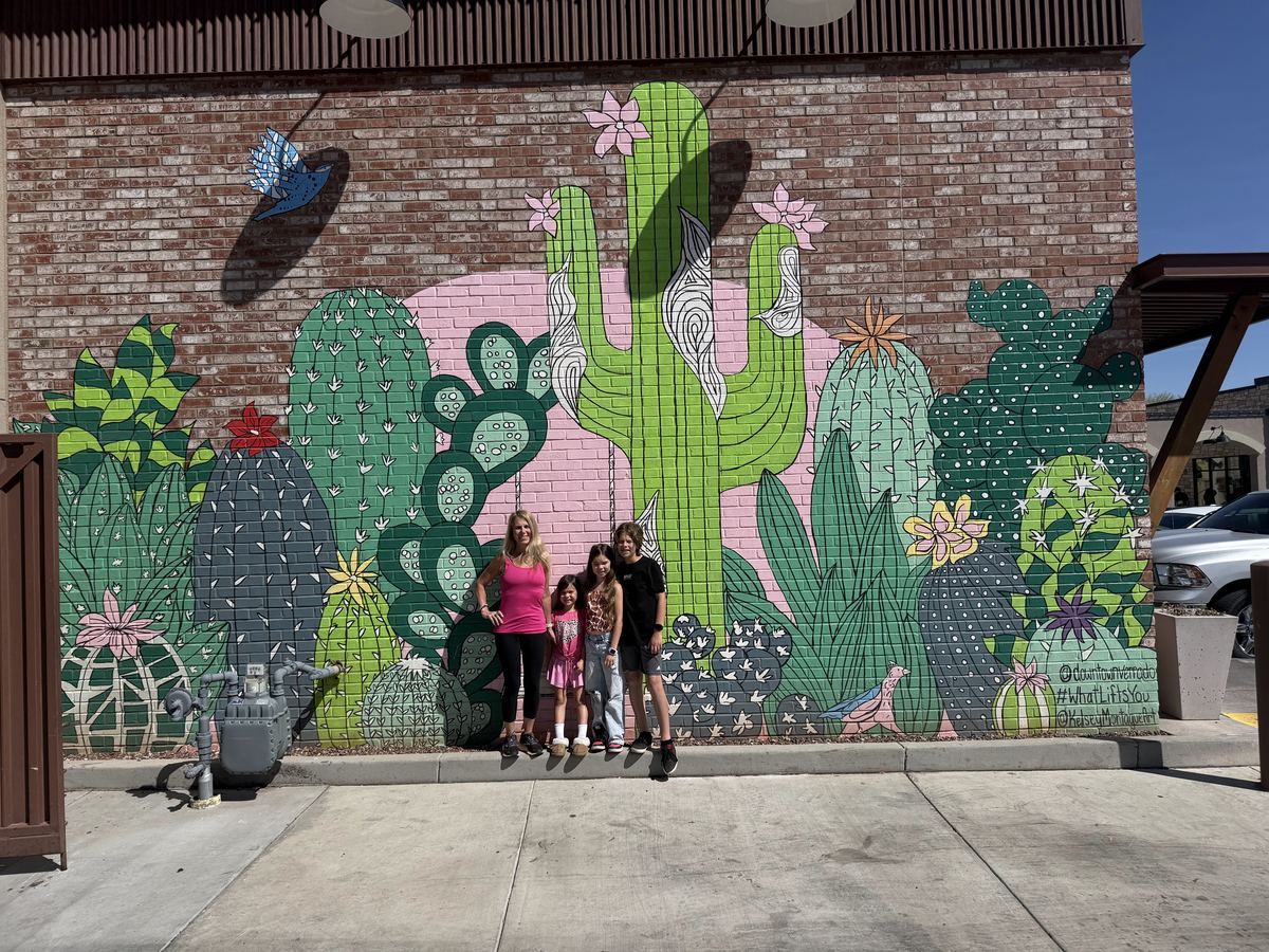 Family at cactus mural