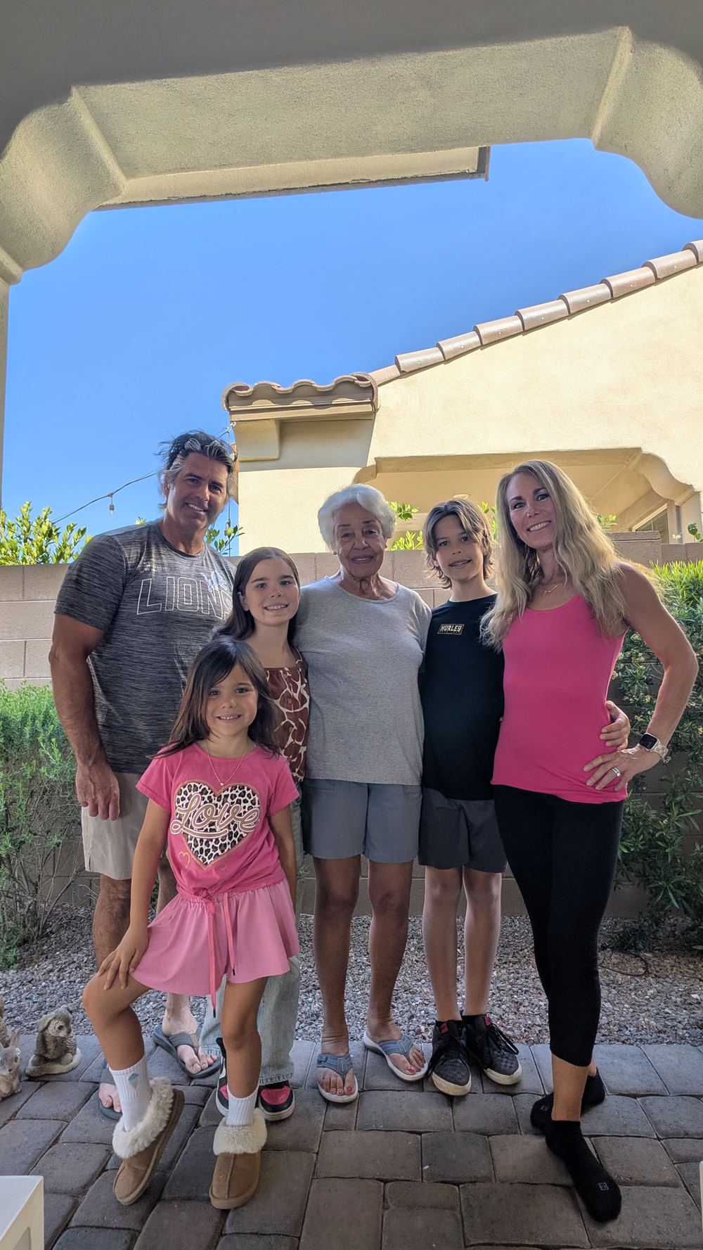 Leone family with Grandma in Buckeye backyard