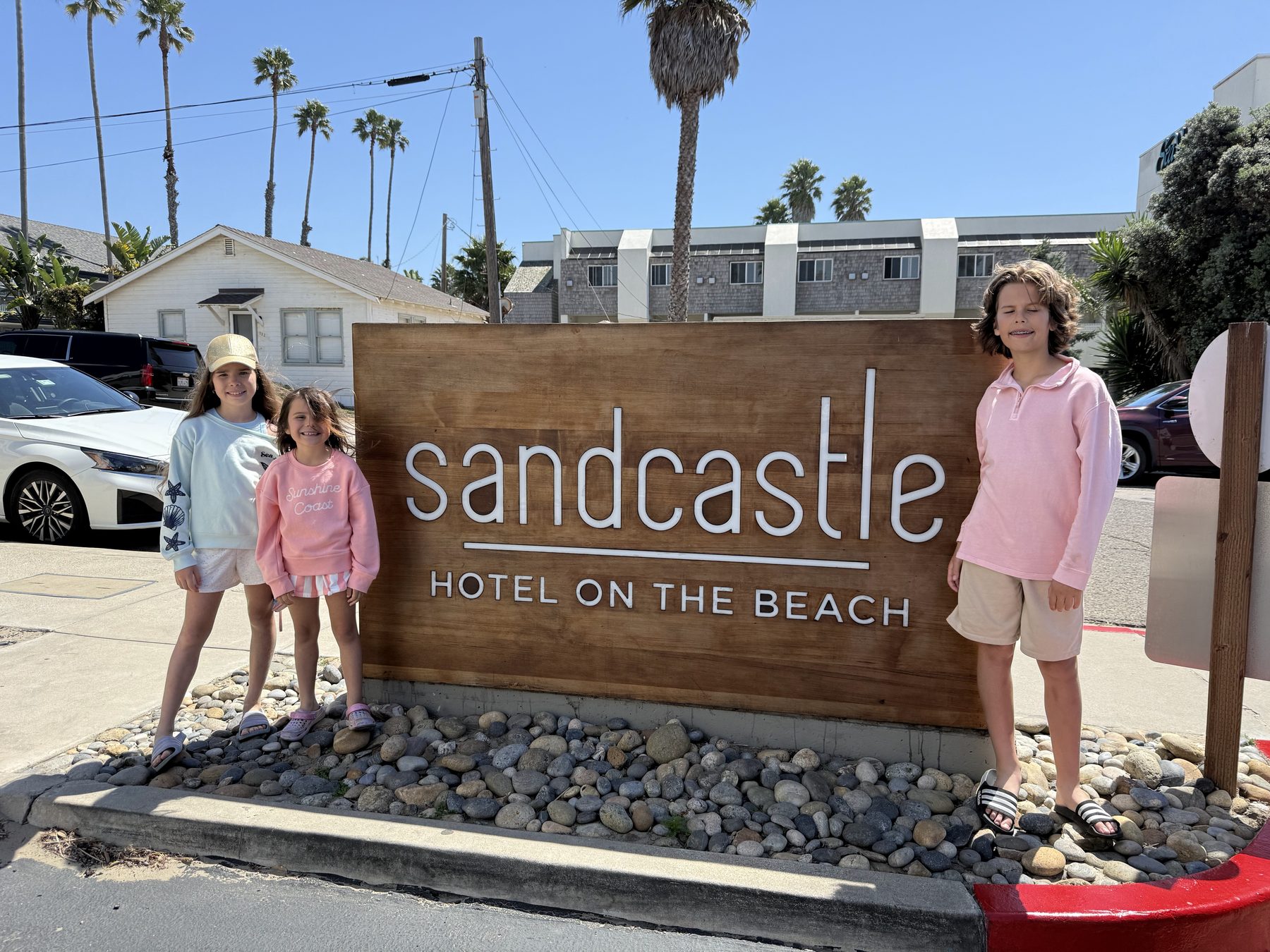 Family with bunny ears on the beach, Easter morning