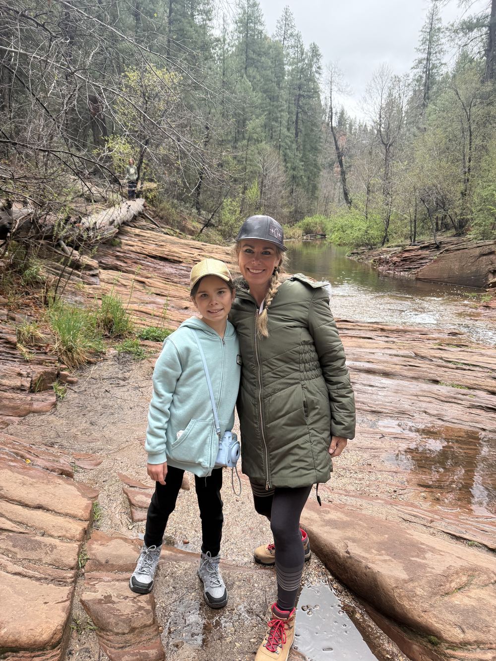 Dana and kid at the creek