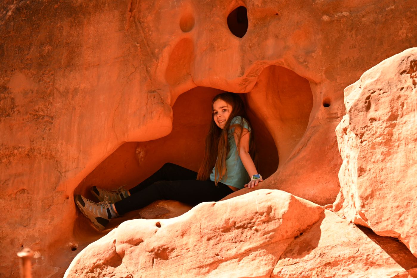 Kid squeezed into red rock cave