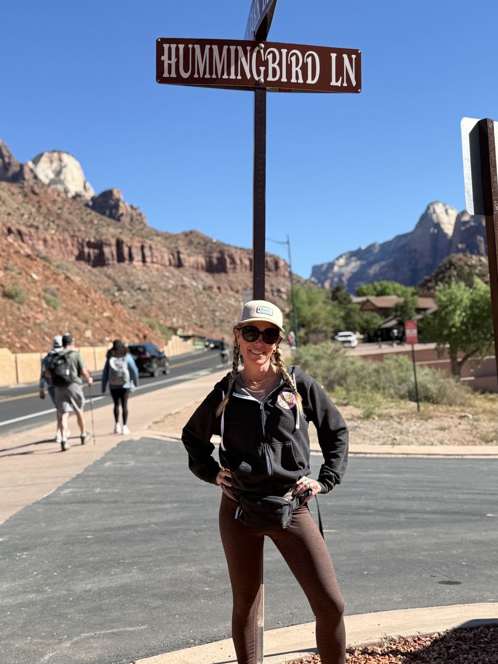 Dana at Hummingbird Lane sign